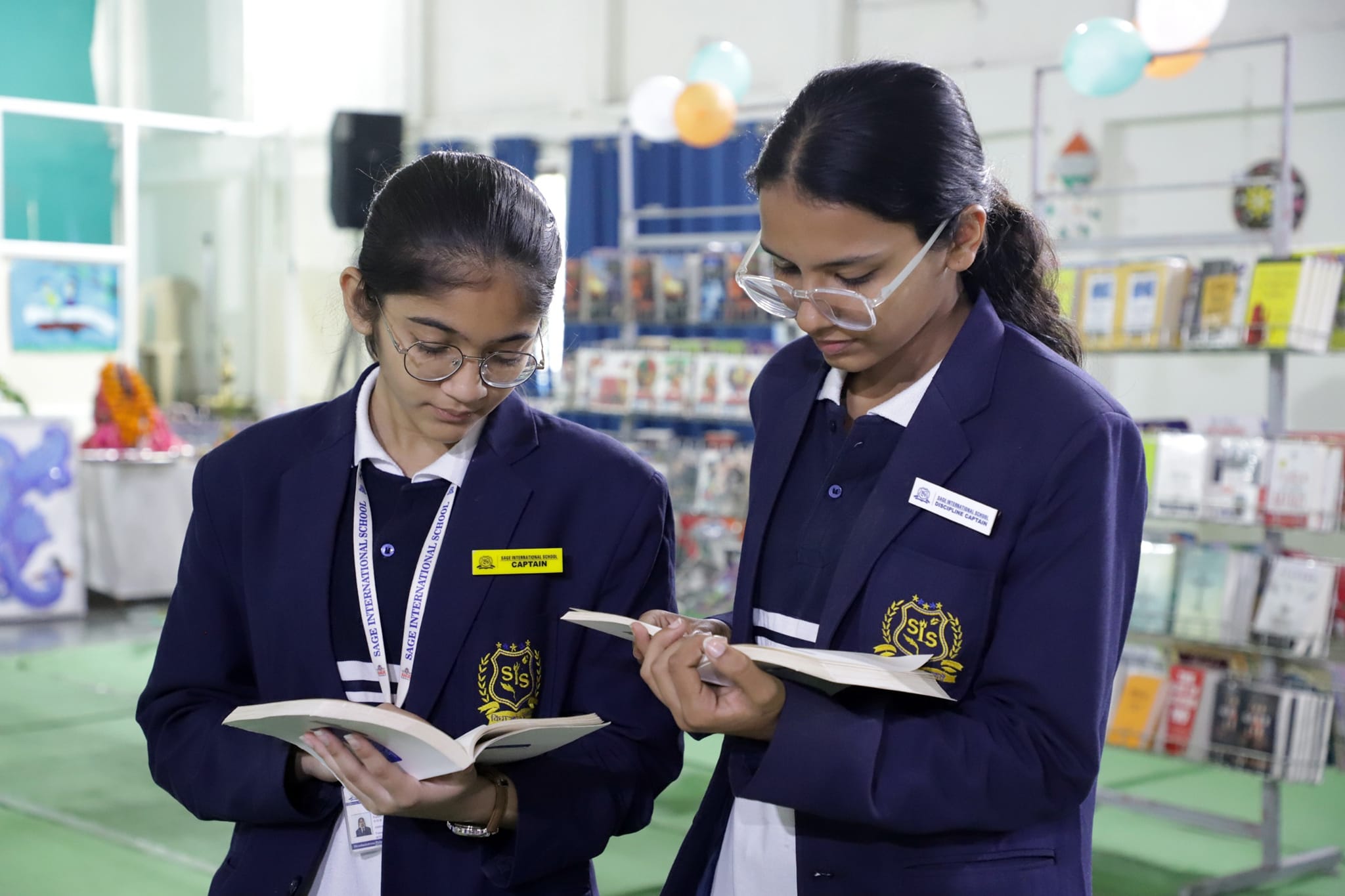 students reading books at SIS